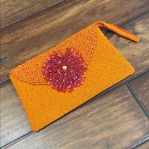 Beaded Orange Wristlet Clutch with Red Flower Accent